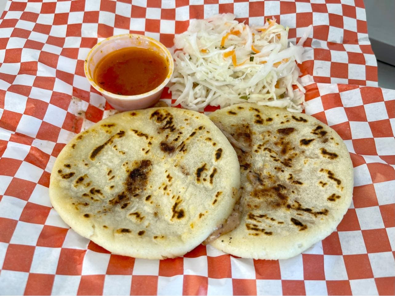 Pupusas with curtido and salsa roja