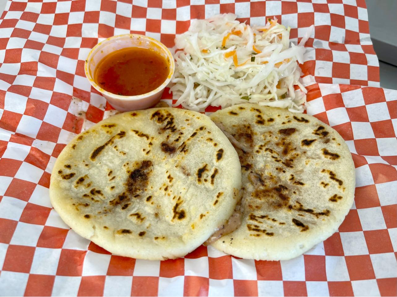 Flatbreads with sauce and shredded topping